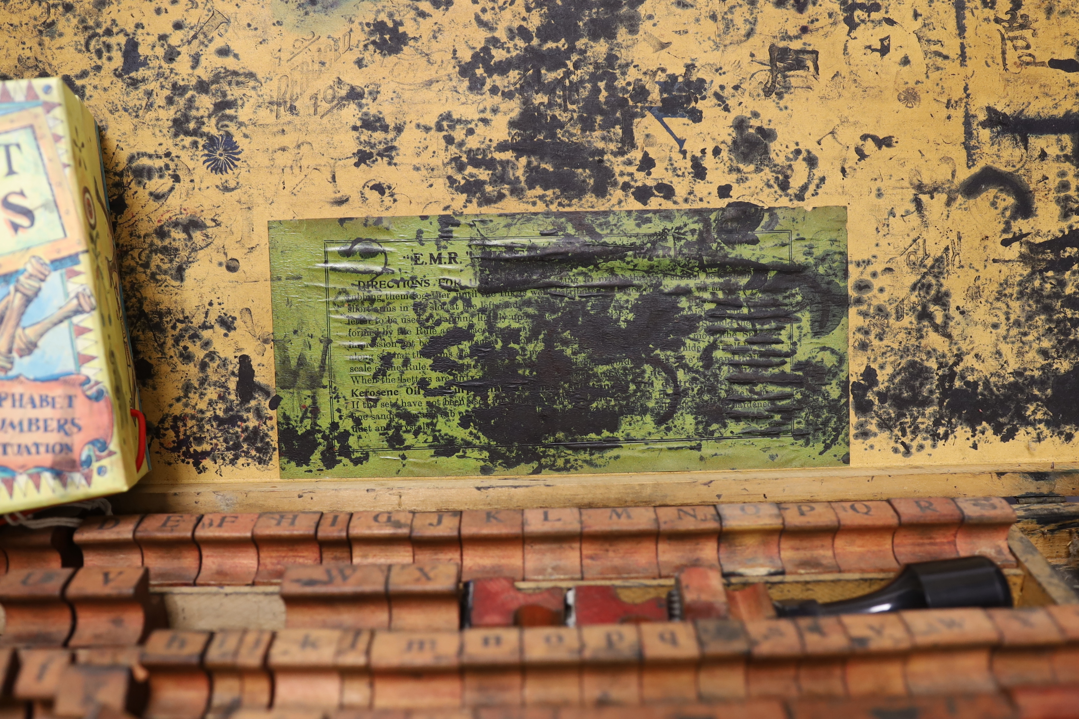 A printer's block set and alphabet stamps, with ink